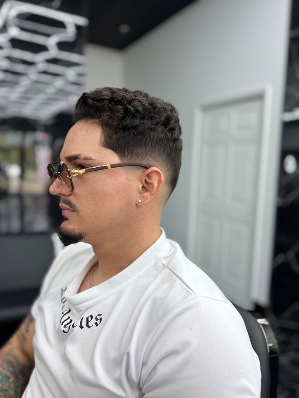 Curly top with a fade, profile