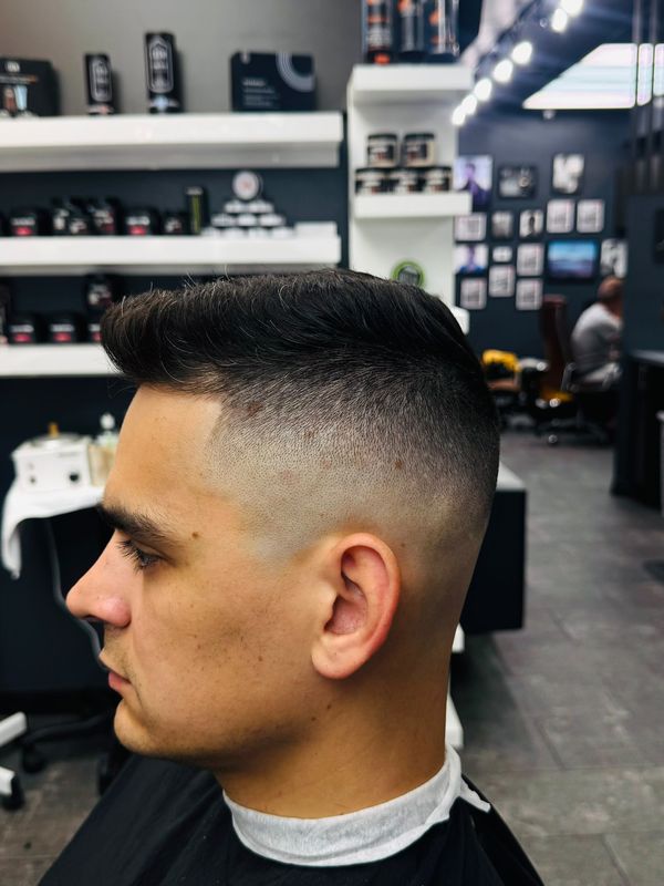 Brushed-up quiff with a skin fade