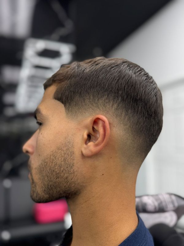 Textured crop with a mid fade and beard